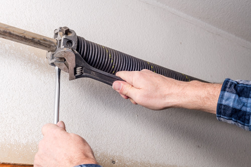 Look for any damage in the garage door spring